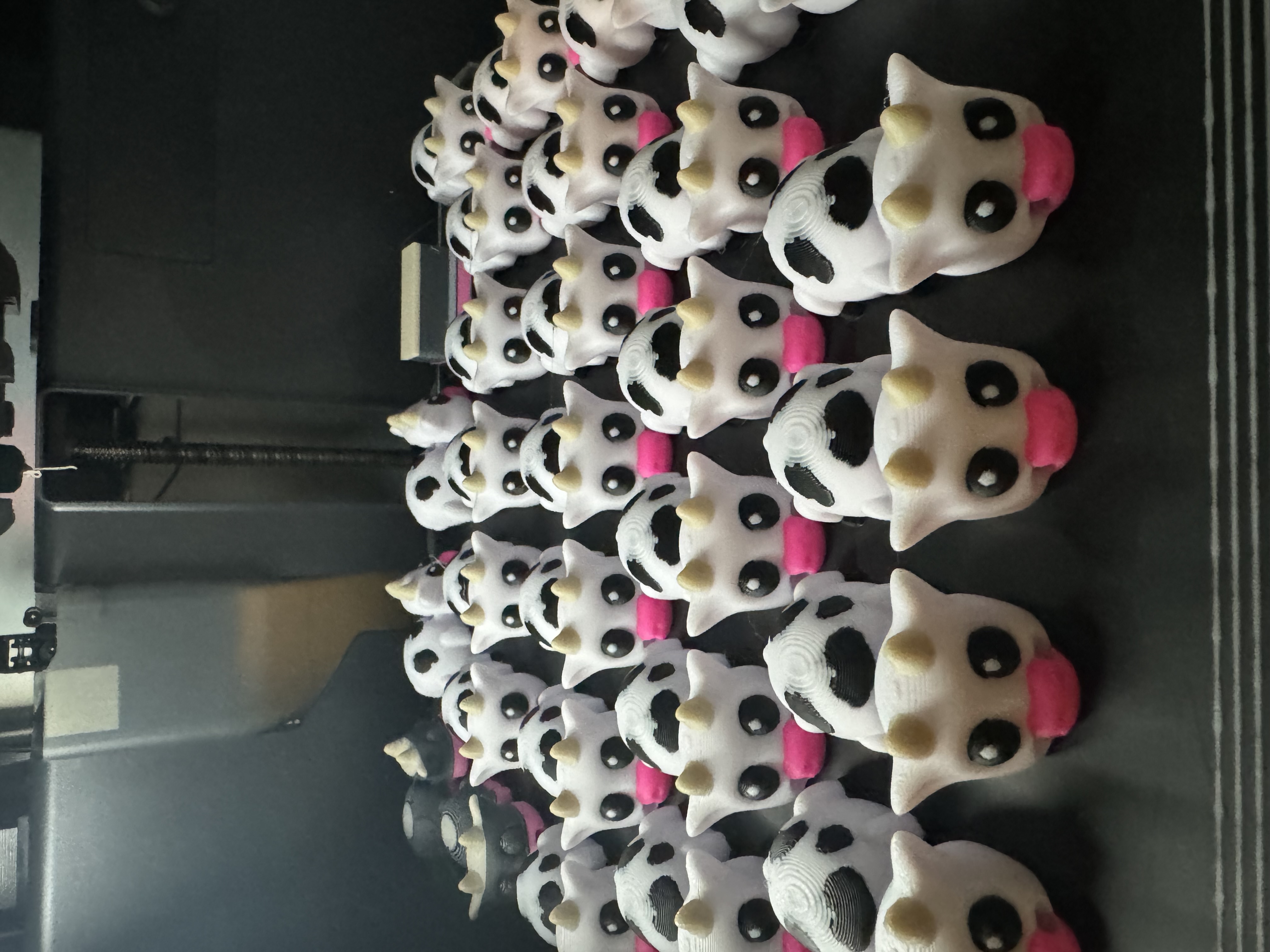 Full print bed of multi-color cow keychains