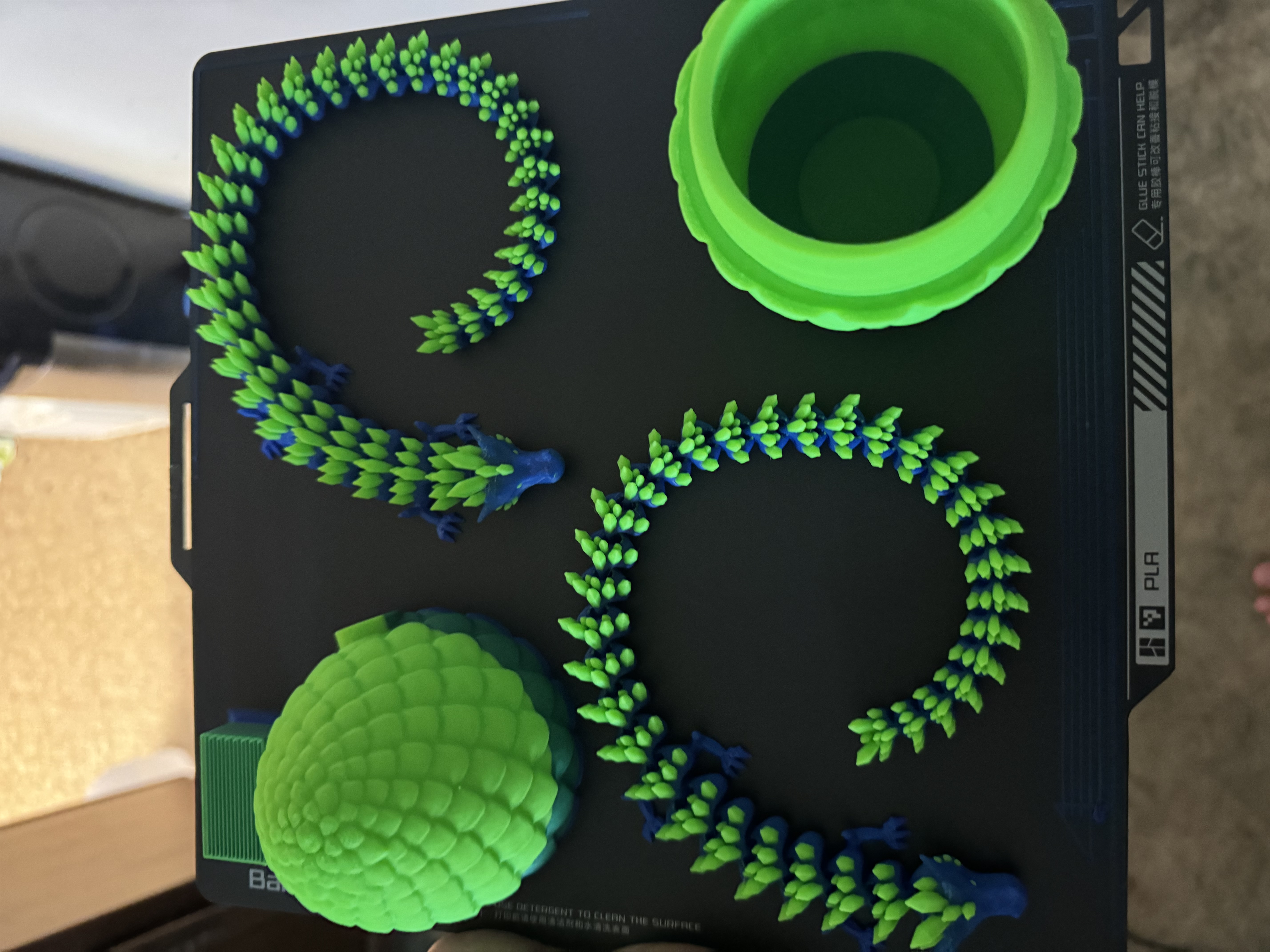 Blue and green dragon fresh off the print bed