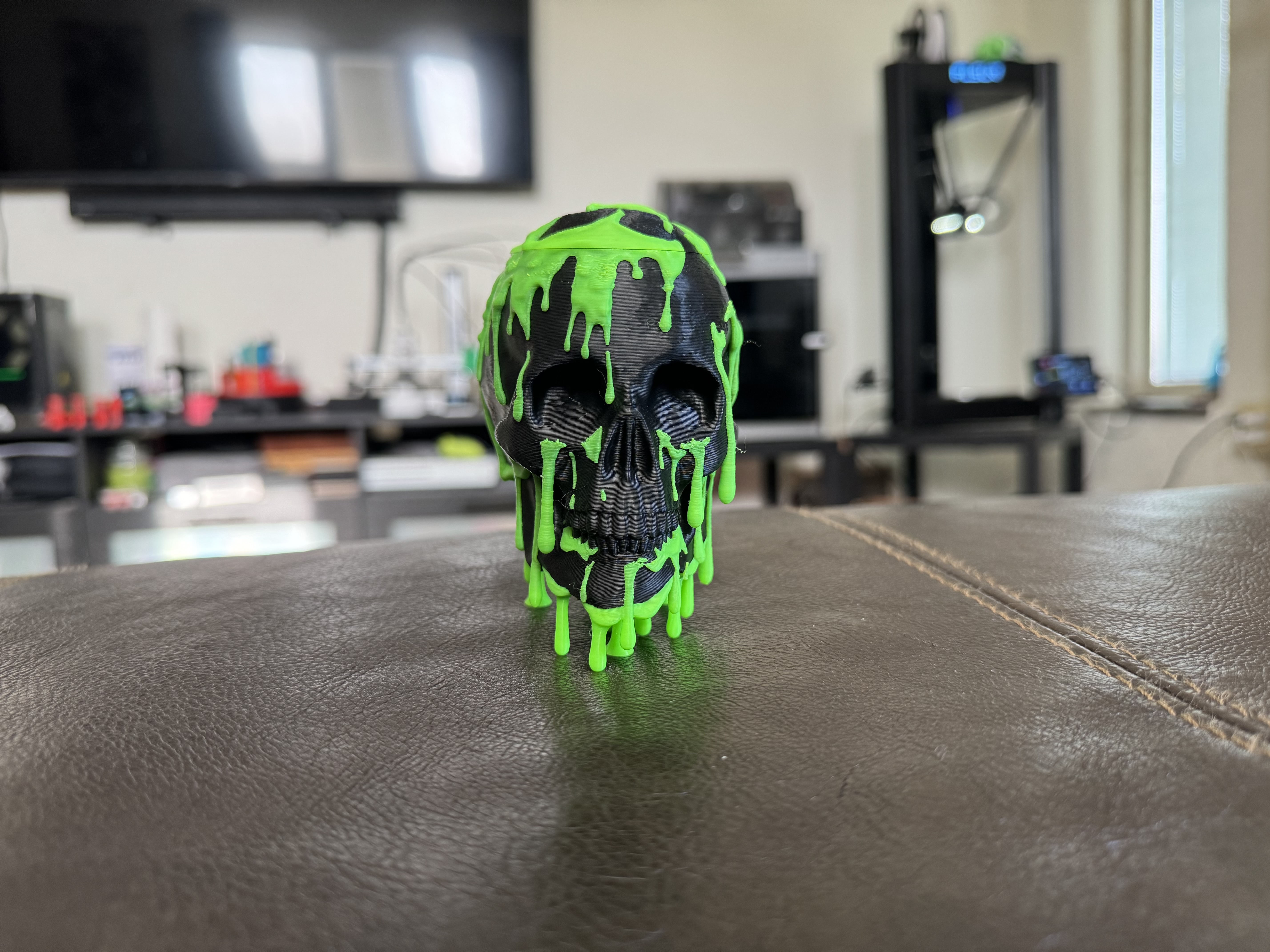 Black skull with neon green slime drip